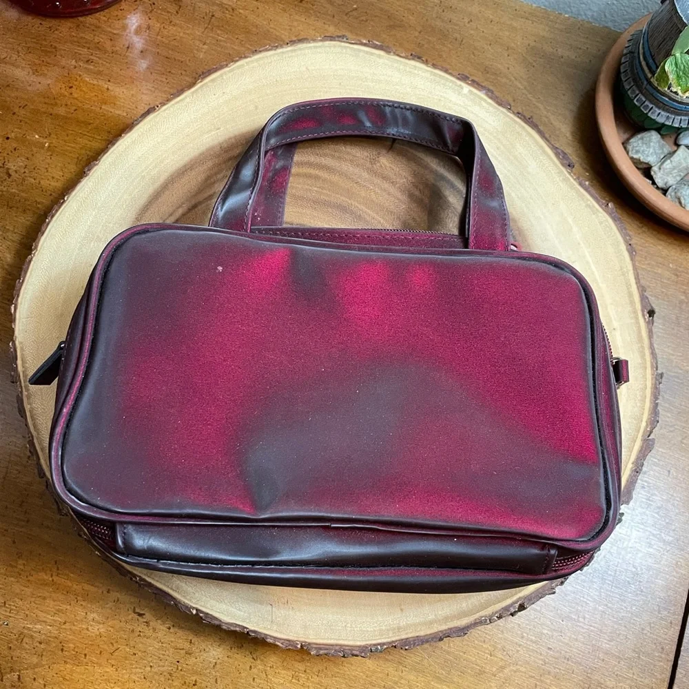 Deep burgundy iridescent handbag make up bag roomy storage opens wide zipper